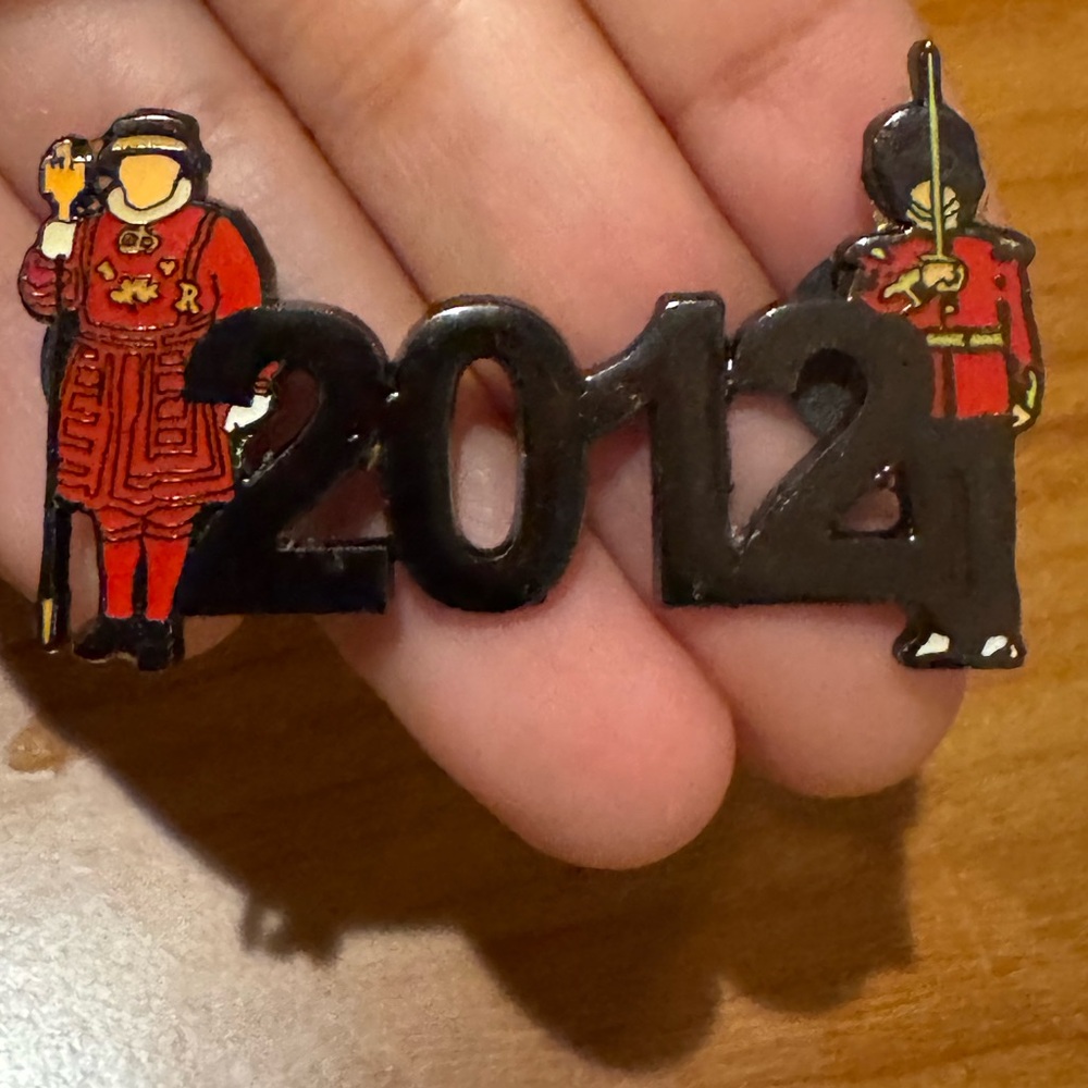 2012 Black and Red Enamel Pin